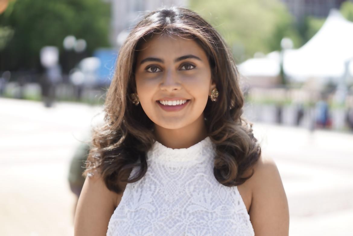 Doctoral Intern Miral Malik smiling at the camera wearing a white shirt